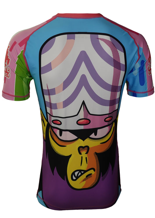 The Power Puff Jiu Jitsu Rash Guard by Retro Grappler features a vibrant cartoon villain monkey with a big brain on the back, in purple, blue, pink, yellow, and green tones. Made from four-way stretch fabric for comfort.
