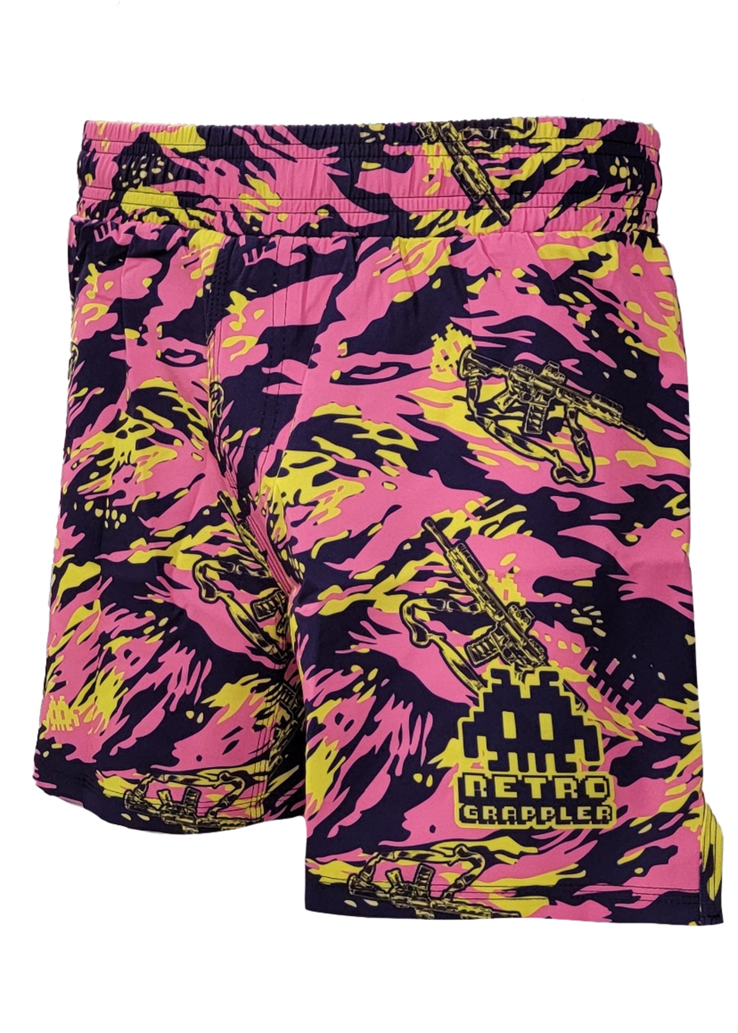 The Thai Tiger Stripe Camo Grappling Shorts by Retro Grappler feature pink, yellow, and black camo with pixelated space invaders and grapplers plus logo/text on one leg. Designed without Velcro for ultimate comfort.