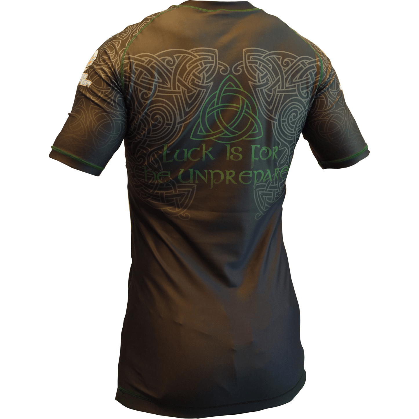 The Retro Grappler Celtic Luck Jiu Jitsu Rash Guard features short sleeves, green Celtic knots, and a triquetra on the back with the text Luck is for the unprepared. Ideal for grappling, wrestling, or MMA; shown from the back on a mannequin.