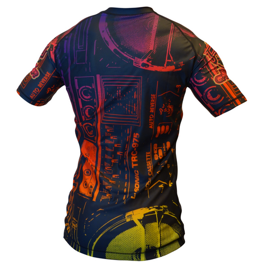 The Retro Grappler Youth - Good Vibes Only Rash Guard features a fitted, short-sleeve design with bold red, orange, yellow, and purple abstract audio equipment graphics on black, shown from the back for a stylish and comfortable look.