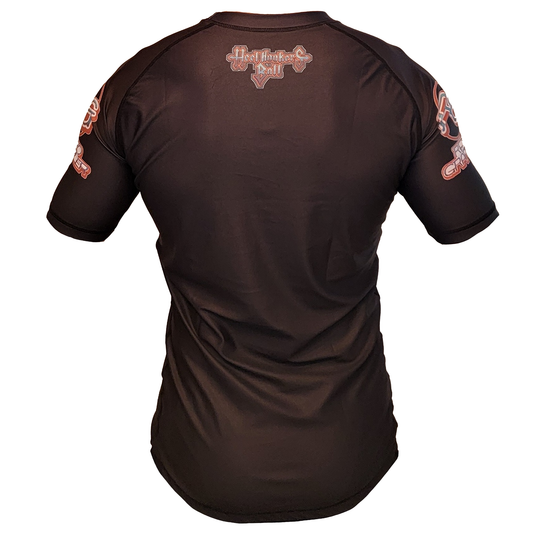 The Retro Grappler Heel Hookers Ball Heel Hook Rash Guard is a fitted black short-sleeve BJJ shirt with red and white logos on the upper back and sleeves, perfect for grappling. Shown from the back on a white background.