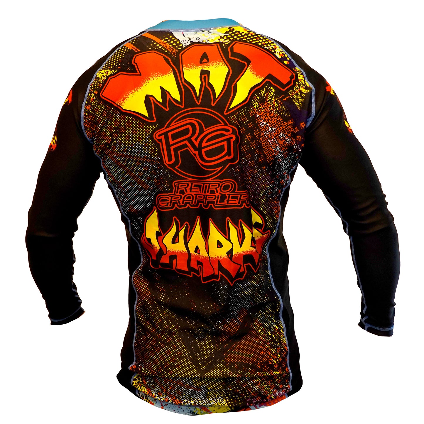 A vibrant long-sleeve Mat Sharks BJJ Rash Guard by Retro Grappler, shown from the back, features bold graffiti-style text in red, yellow, and orange on a black and multicolored Street Sharks-inspired design.