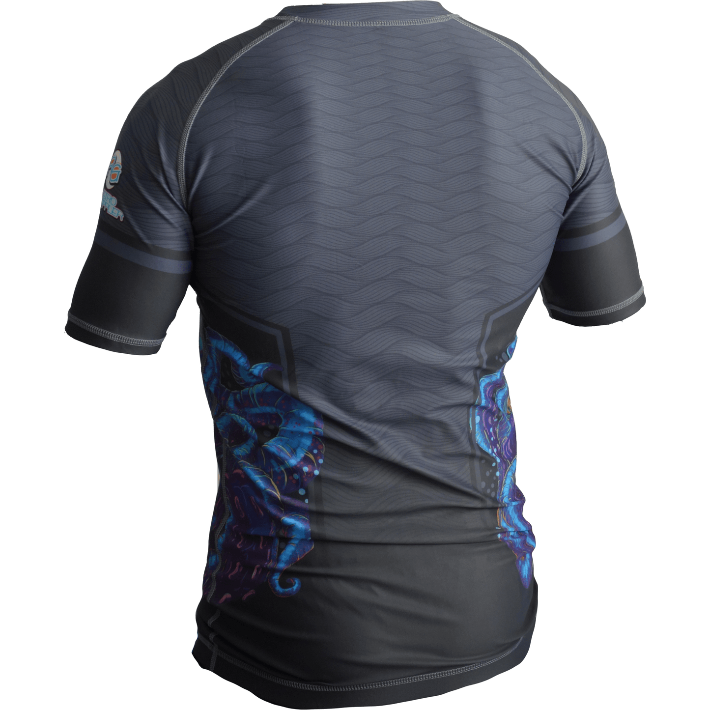 A back view of the Retro Grappler Wrapped Up Jiu Jitsu Rash Guard shows its short sleeves, dark gray four-way stretch fabric, original octopus designs on the sides, and subtle wavy patterns across the upper back.