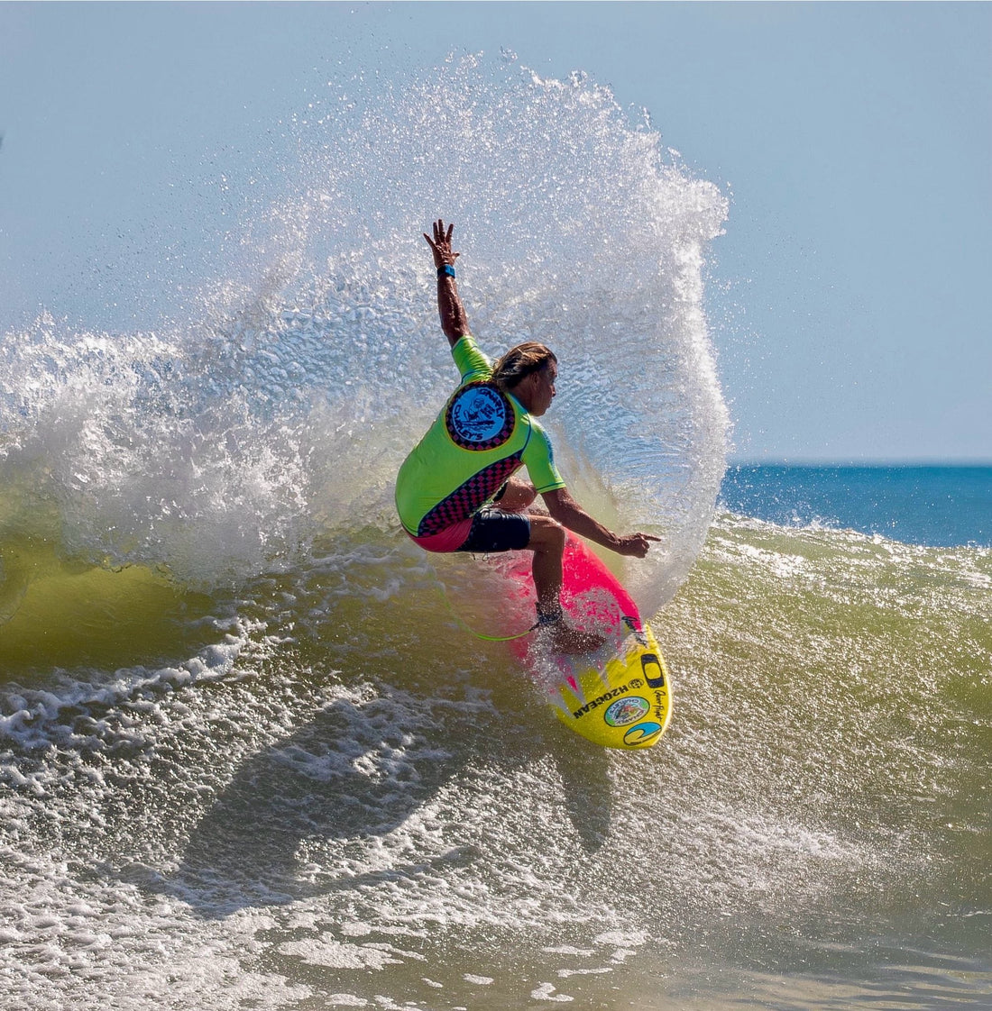 gnarly charley wearing a wave hugger rash guard while surfing in florida