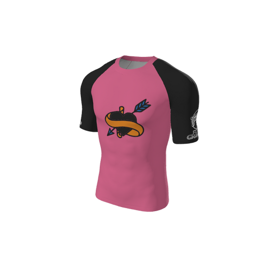 The Retro Grappler Custom Single Color Short Sleeve Rash Guard by Custom features black sleeves, a pink body with a heart and arrow graphic, plus a white logo on the left sleeve—ideal for workouts or casual wear.