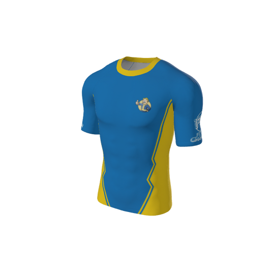 The Custom Retro Grappler Custom Jagged Short Sleeve Rash Guard is blue with yellow accents, a stylized lion logo on the chest, graphic design on one sleeve, and bold yellow zigzag side stripes for an athletic look.