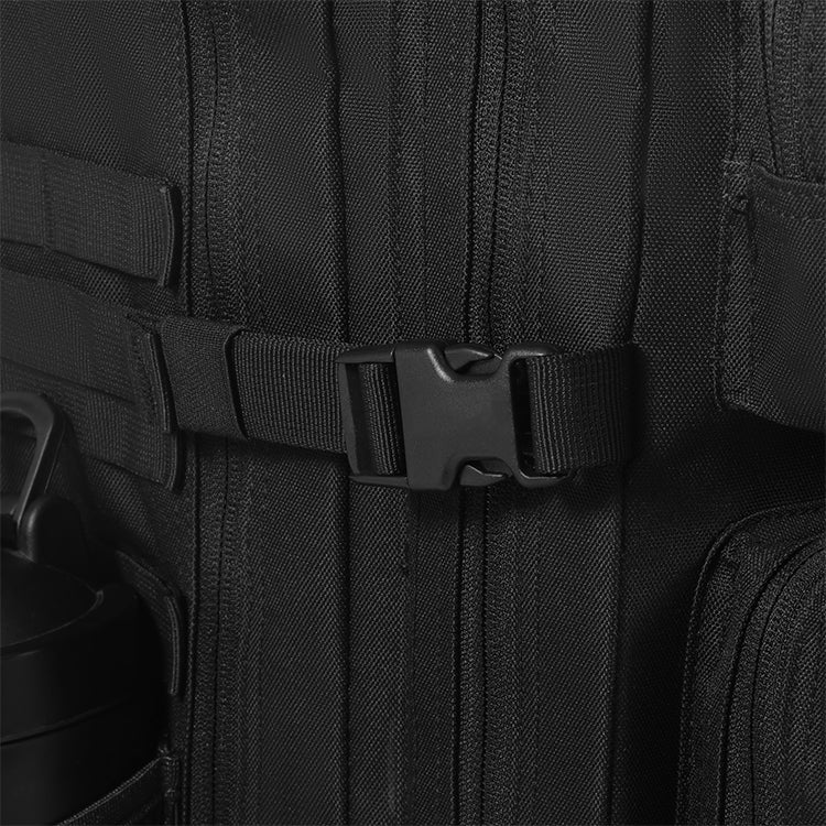 Close-up of a black backpack with a buckle on a dark background