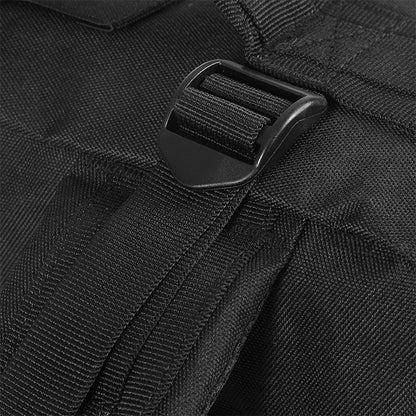 Close-up of a black backpack strap buckle on a textured black fabric background