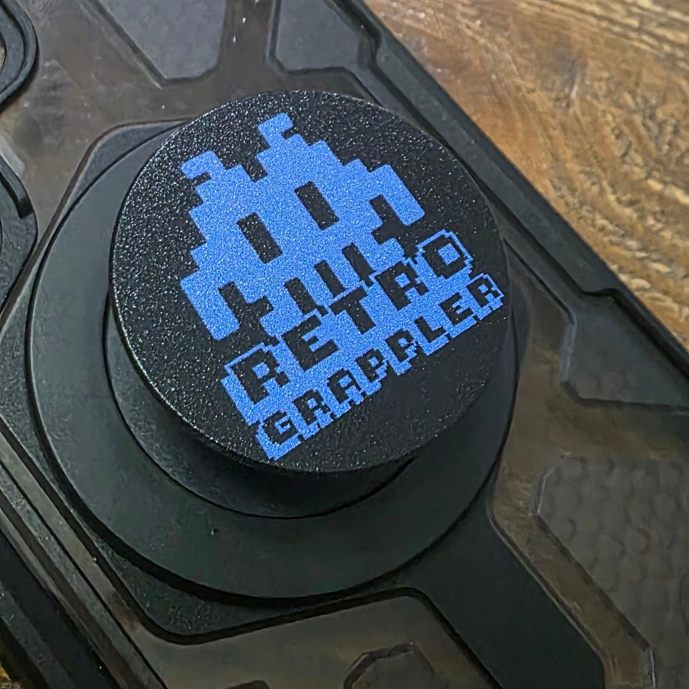 Black PopSocket MagSafe with blue Retro Grappler Logo