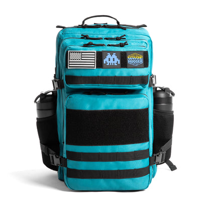 Teal backpack with multiple patches on a white background